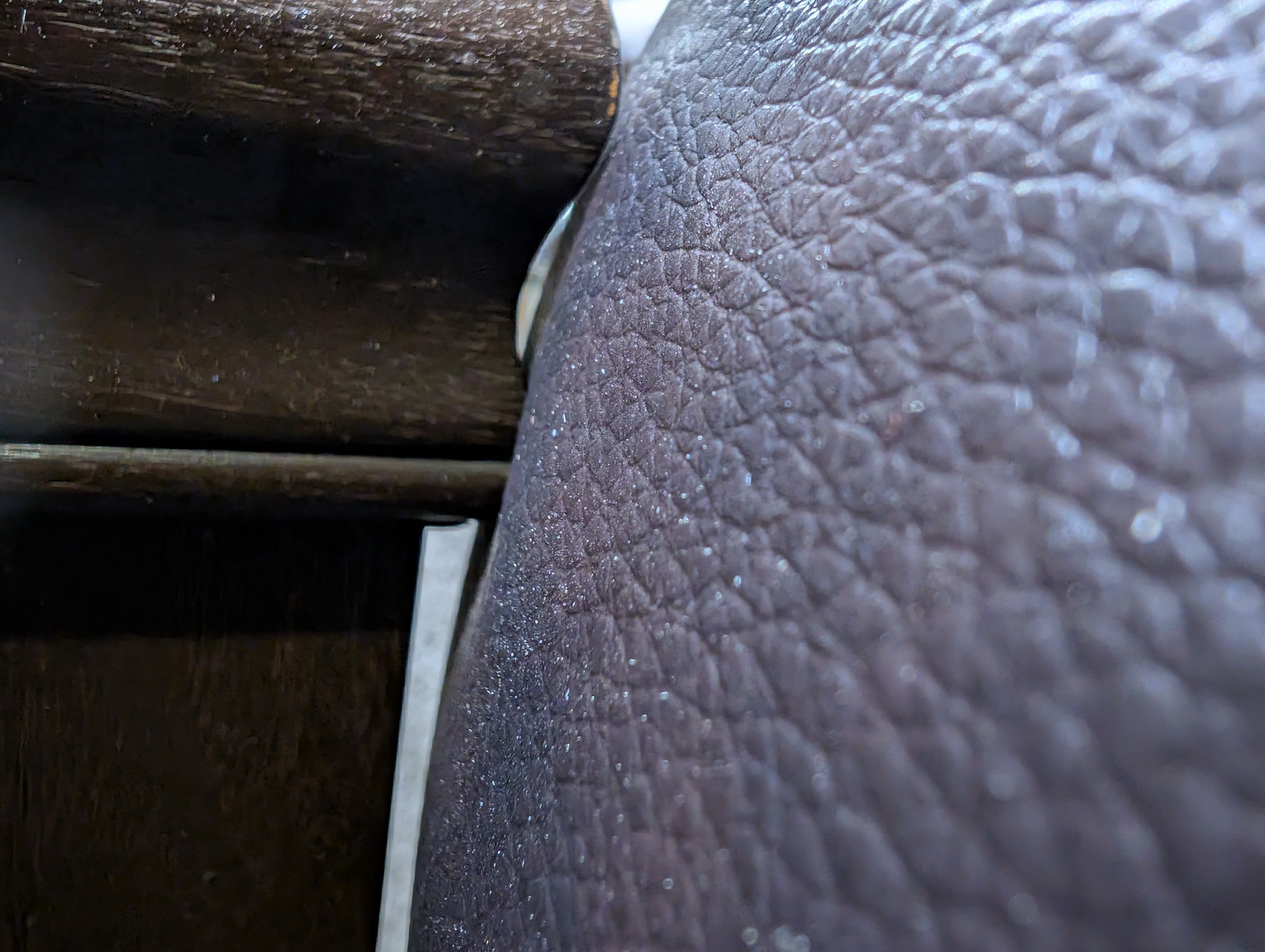 Close-up of two pieces of furniture touching