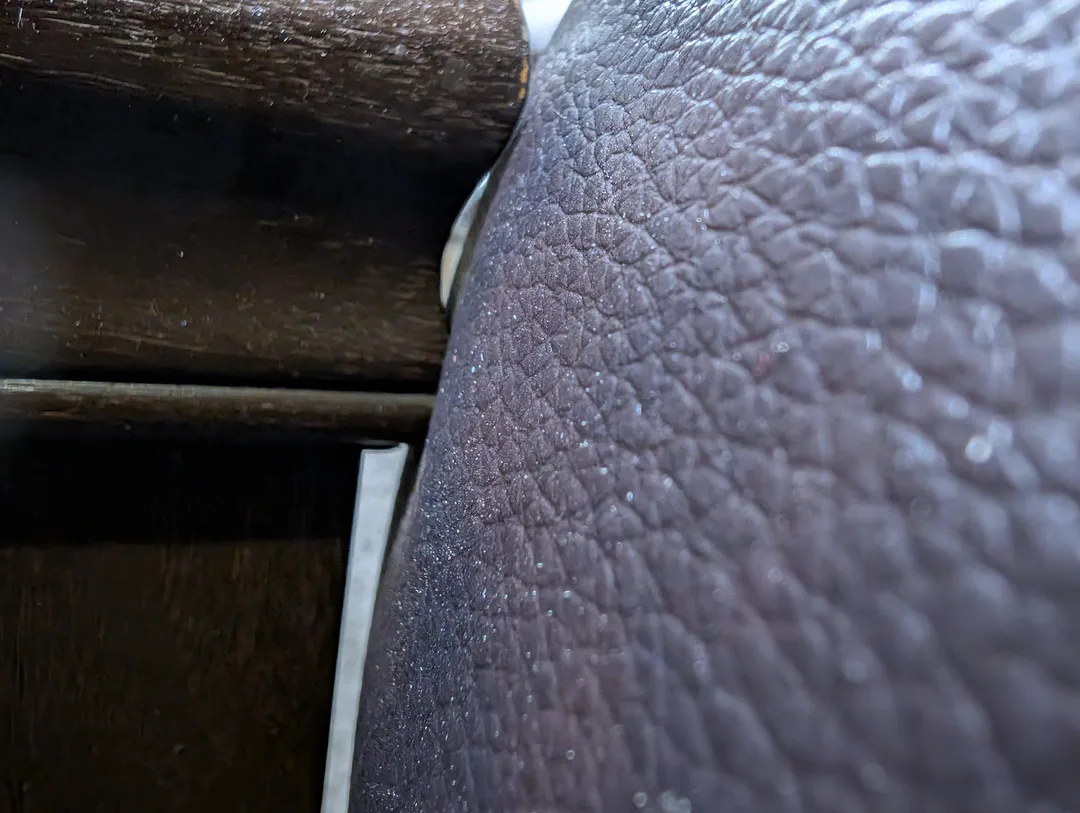Close-up of two pieces of furniture touching