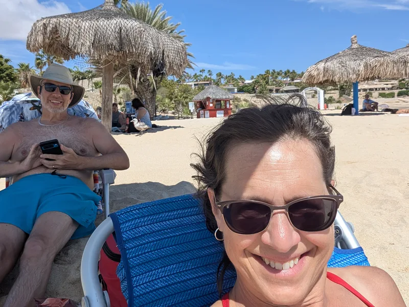 Bob and Lana Gates in swimsuits on a beach