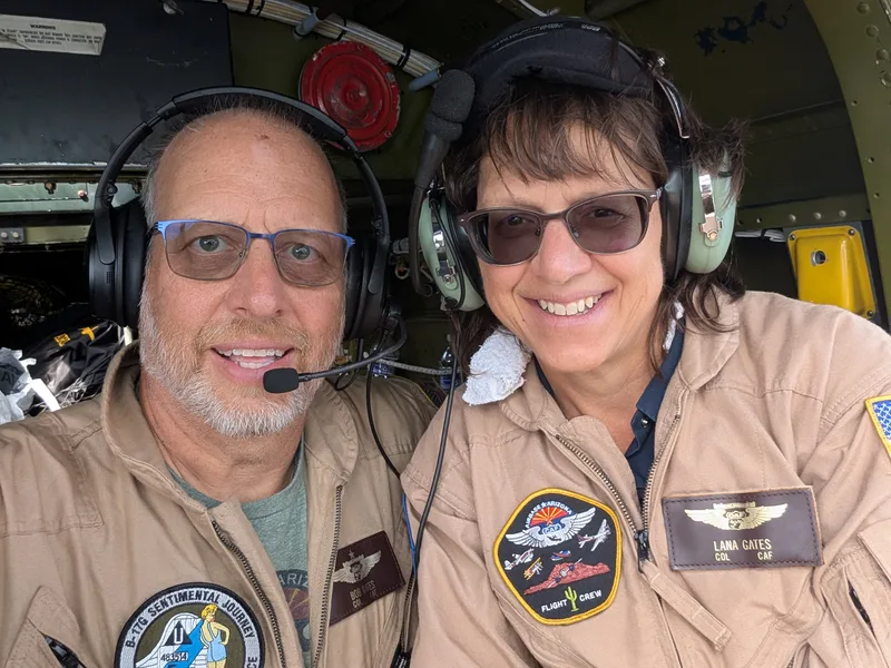Bob and Lana Gates in flight suits on a B-25