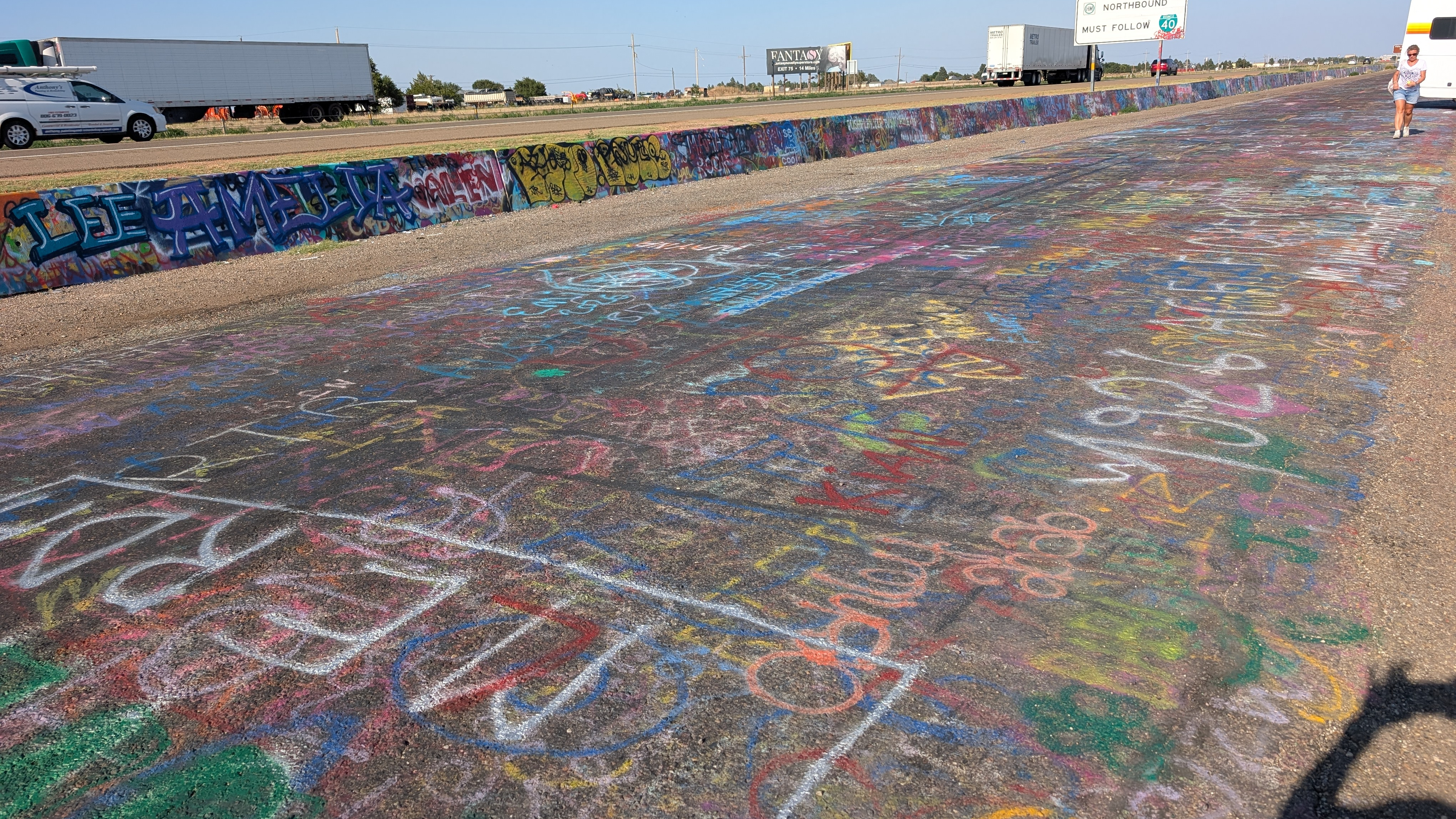 Graffiti on the frontage road and K-rails near Cadillac Ranch