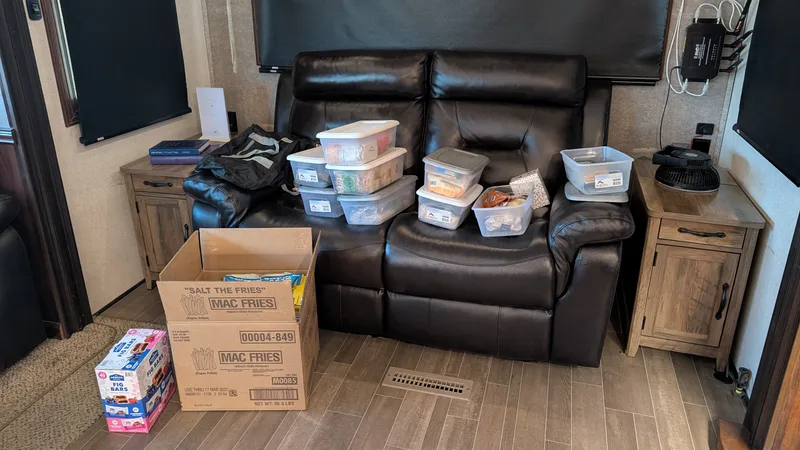 Containers of food on an RV loveseat