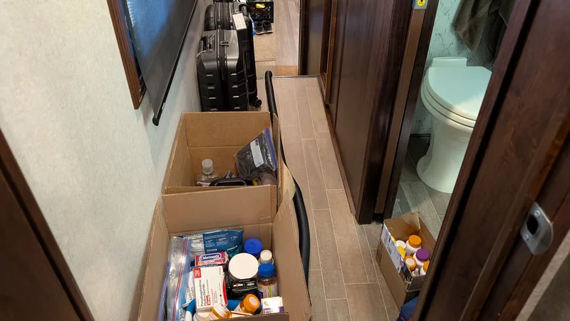 Boxes and suitcases in an RV hallway