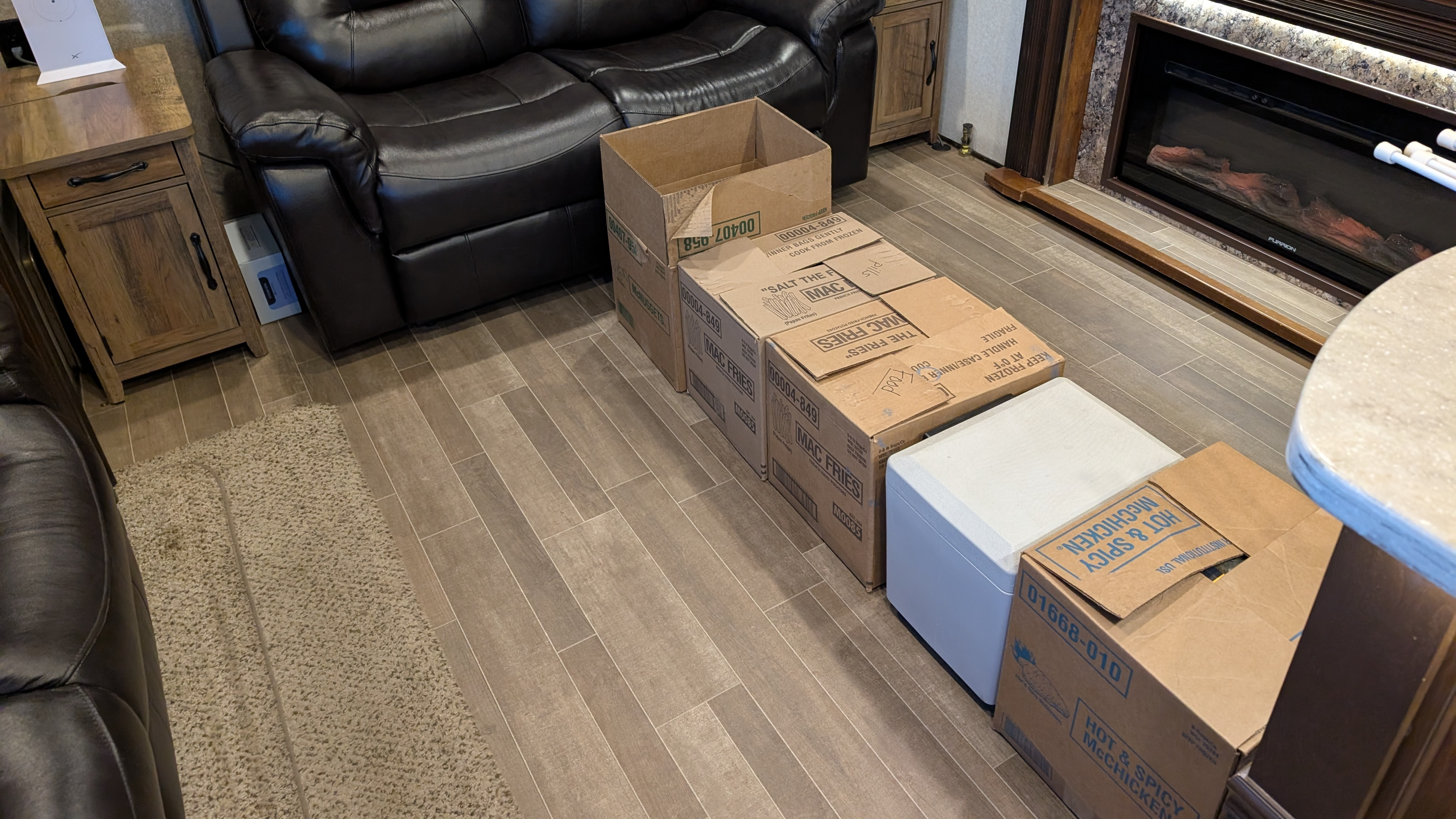 Boxes in a line in the middle of an RV floor