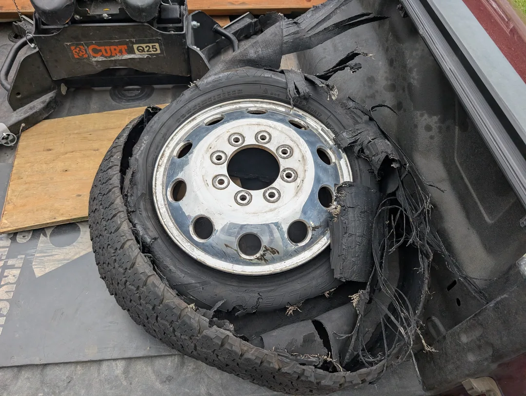 Shredded tire in the bed of a truck